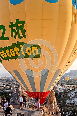 Moment of balloons landing wÄ±th people 1 Editorial Stock Photo